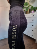 Black velour sweatpants with gold lettering