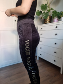 Black velour sweatpants with gold lettering