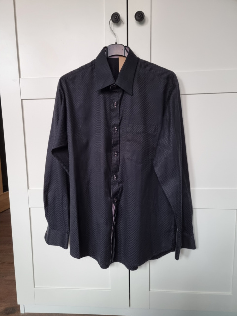 Elegant black men's shirt with a subtle pattern Elegant black men's shirt with a subtle pattern