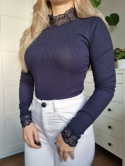 Navy blue ribbed turtleneck with a lace stand-up collar