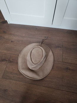 Beige hat made of natural leather of an African animal