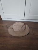 Beige hat made of natural leather of an African animal