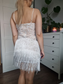 A crazy, feminine dress with fringes and embroidery for New Year's Eve, a party