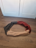 Woolen snood in shades of red, gray, and beige