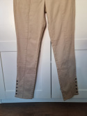 Beige cotton trousers with buttons on the calves